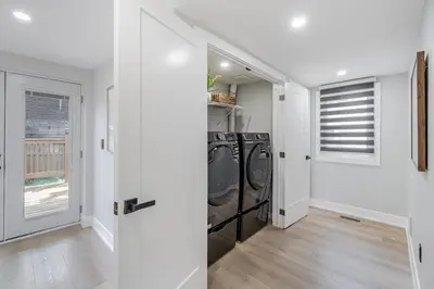 a laundry room with a washer and dryer at The Millertime Experience in Brantford