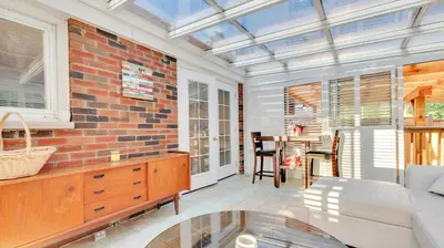 a living room with a brick wall at R&R Heaven Music 4 the Soul See fall colors Hottub in Campbellford