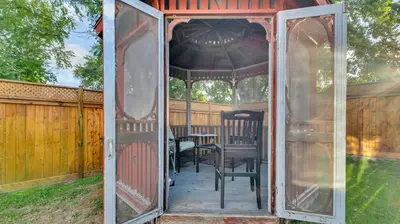 a gazebo with a table and chairs in a yard at R&R Heaven Music 4 the Soul See fall colors Hottub in Campbellford