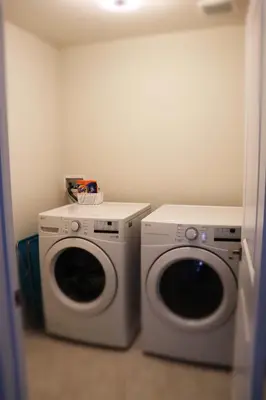 a laundry room with a washer and dryer at Severn Woodland in Severn
