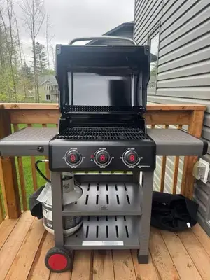 a grill sitting on top of a deck at Severn Woodland in Severn