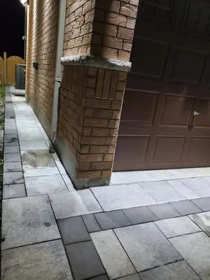 a house with a garage door and a driveway at 3 bdrm 3 bath bsmt Brampton Toronto, Sleeps 16 in Brampton