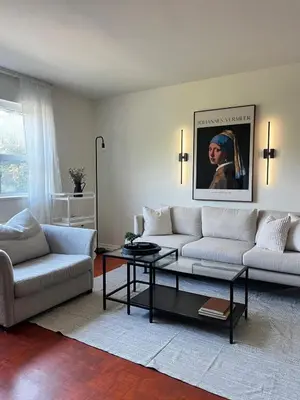 a living room with a couch and a coffee table at Upper Beaches Apartment in Toronto