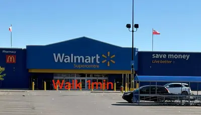 a walmart store with a car parked in a parking lot at 9mins airport 1 min to shopping mall in Toronto