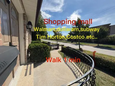a walkway outside of a house with a fence at 9mins airport 1 min to shopping mall in Toronto