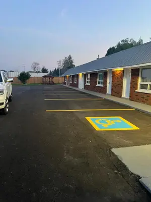 a parking lot in front of a building at Sunrise Motel in Owen Sound