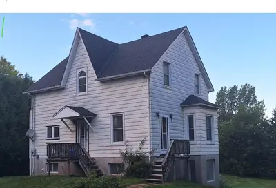 a large white house with a black roof at Century House on Quarter acre lot in Acton