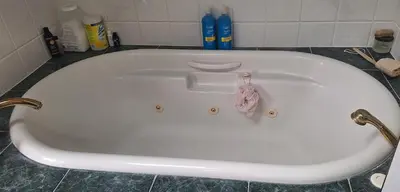a white bath tub in a bathroom at Century House on Quarter acre lot in Acton