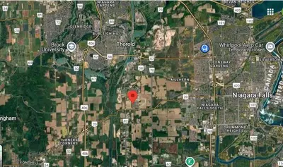 a map of a city with a red marker at Two Adjacent Modern Homes in West Niagara Sleep 16 in Thorold