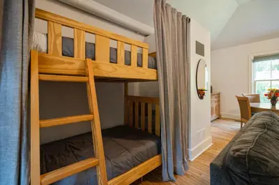 a bedroom with two bunk beds in a room at Niagara on the Lake Walkable Old Town Retreat in Niagara on the Lake
