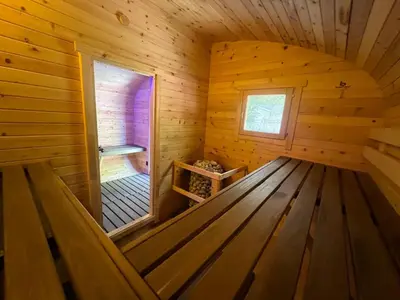 a room in a log cabin with a window at Hot Tub BANYA Sauna True Cottage experience in Innisfil