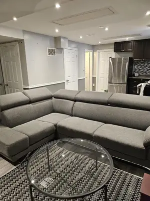 a living room with a couch and a table at 1 BR Bsmt, Sep Entrn, Fre Prkn, Wi-Fi, Ktchn, Lndry in Mississauga