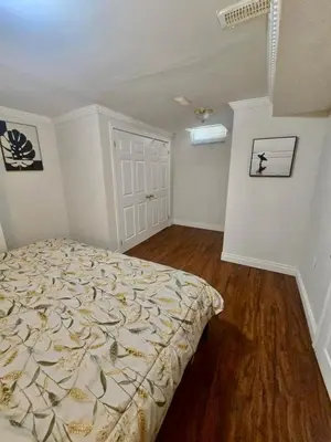 a bedroom with a bed in a room at Quincy Home in Mississauga