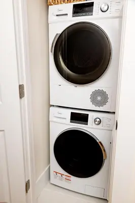 two microwaves stacked on top of each other in a kitchen at Dundas and Brock Suitel in Toronto