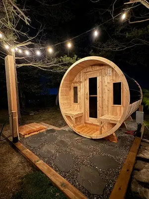 a large wooden sauna with a round building at Waterfront Casa in wine County with SAUNA and HOT TUB in Demorestville