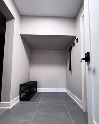 a room with white walls and a tile floor at Modern Suite in Etobicoke - Near Airport & Downtown! in Toronto