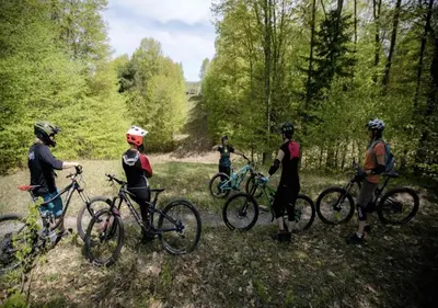 a group of people standing with bikes on a trail at King Bed Suite with Pool and Hot Tub Access in Shanty Bay