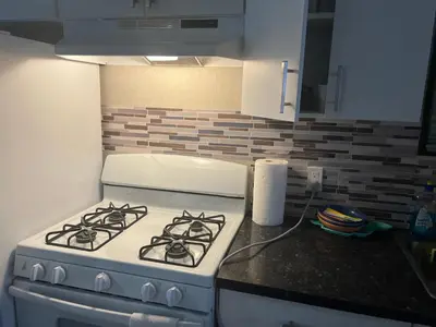 a white stove top oven in a kitchen at Cottage on Niagara on the Lake in Niagara on the Lake