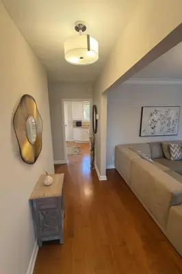 a living room with a couch and a table at Spacious 5-Bedroom House in Thornhill in Vaughan