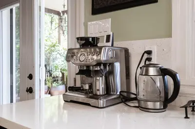 a coffee maker sitting on a counter in a kitchen at 4 Bedroom Stoney Creek Nature Oasis Sauna, Games & Luxury Comfort in Hamilton