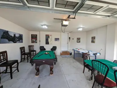 a room with a pool table and ping pong tables at Entire Home in Niagara Region, 6 bedrooms, 5 baths with a game room, arcades in Thorold