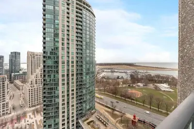 a view of a tall building in a city at Stylish Fort York Condo w Patio Prime Location in Toronto