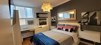 a bedroom with a bed and a desk and a window at Medium size room for 2 in Toronto