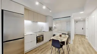 a kitchen with a table and chairs and a room at Cozy 2 Bdrm 2 Bath Entire Suite - Centre Hamilton in Hamilton