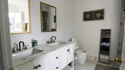 a bathroom with a sink and a toilet at Spacious 5br Home W Parking In Mississauga in Mississauga