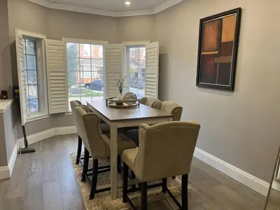 a dining room with a table and chairs at Spacious 5br Home W Parking In Mississauga in Mississauga