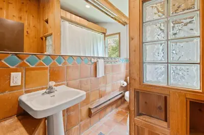 a bathroom with a sink and a window at Stunning Mountain Getaway with Open Concept Design in Blue Mountains