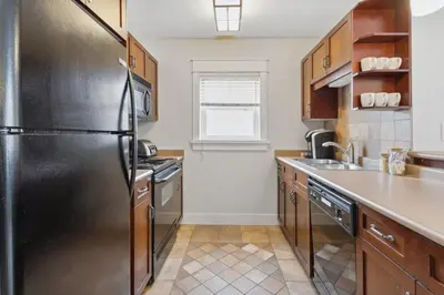 a kitchen with a stainless steel refrigerator at The 19th Hole at Blue with Hot Tub in Blue Mountains