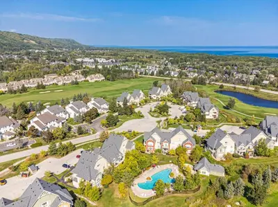 an aerial view of a home with a swimming pool at Fore Seasons Escape with Golf in Backyard in Blue Mountains