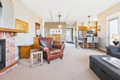 a living room with a couch and a fireplace at Fore Seasons Escape with Golf in Backyard in Blue Mountains