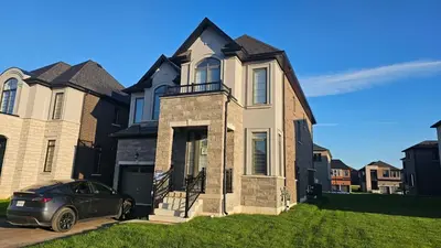 a house with a car parked in front of it at Grand Woodstock Luxe House 4BR in Woodstock