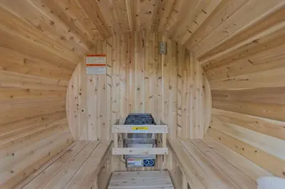 a wooden cabin with a mattress in the middle at Niagara Retreat|HotTub|Sauna|Games|15 Min to Falls in Thorold