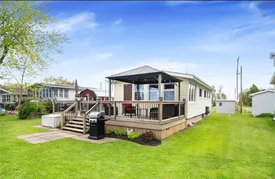 a mobile home with a gazebo in a yard at Lakefront Lake Erie with Amazing Views 3BR Pet Friendly 1 HR from Hamilton and Niagara