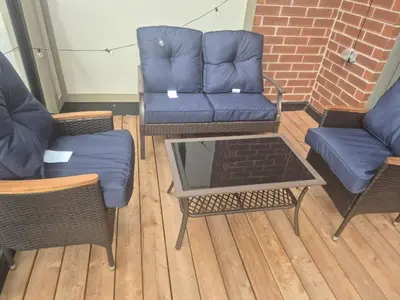 a living room with chairs and a couch and a table at Stylish 3BR 2.5 Bath Townhouse with Patio and parking in Mississauga