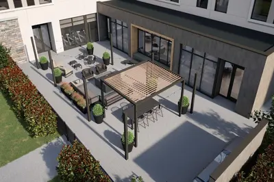 an overhead view of a patio with a table and benches at Staybridge Suites Aurora East by IHG in Aurora