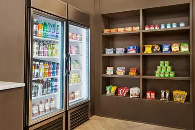 a refrigerator filled with lots of food and drinks at Staybridge Suites Aurora East by IHG in Aurora