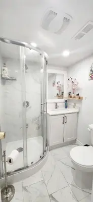 a bathroom with a shower and a toilet and a sink at Pacific Mall Bright & Cozy Rooms with Privated Bathrooms in Toronto