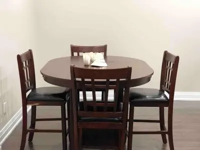 a dining room table with four chairs and a table and chairsuggest at Heaven on Earth in Ajax