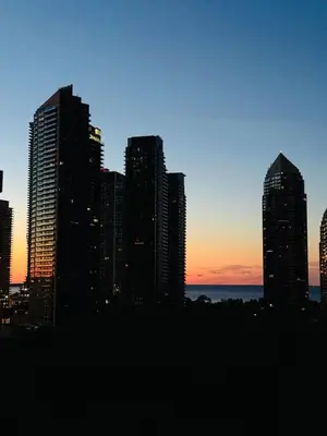 a city skyline with tall buildings at sunset at Lakeview in Toronto