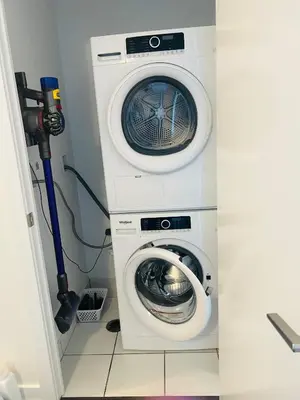 a washing machine and a washer in a room at Lakeview in Toronto