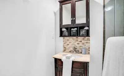 a bathroom with a sink and a shower at Stylish Modern 2-bedroom Basement Suite in Brampton