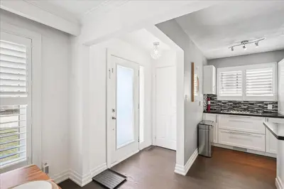 an empty kitchen with white walls and a window at Bright 3-BDRM House, Family Home & Parking, YYZ Airport in Mississauga