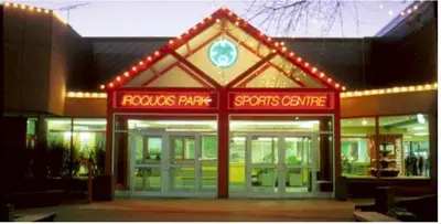 a building with a store with lights on it at Cozy 2 Bedroom Suite, 5 mins from Thermea Spa in Whitby