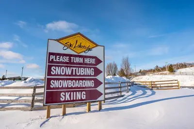 a sign for a snowmobilingking and snowmobiling skiing at Cozy 2 Bedroom Suite, 5 mins from Thermea Spa in Whitby
