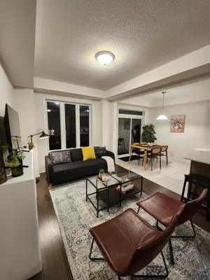 a living room with a couch and a table at Cozy Home for 10 people in Kitchener
