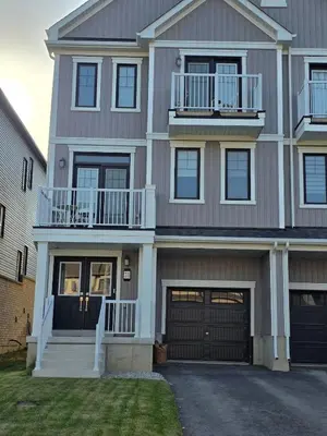 a large house with a garage at Modern Stylish Cozy Home Balcony Wifi in Caledonia